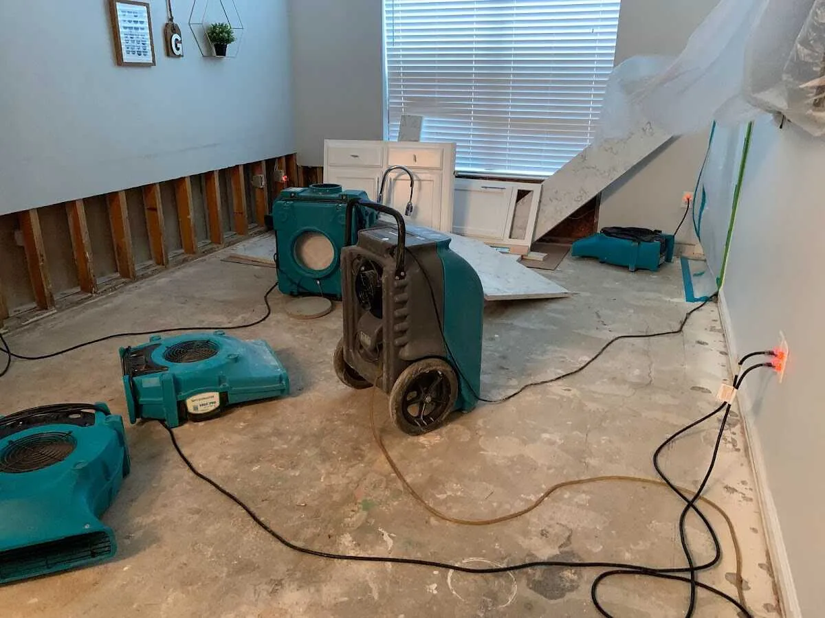 Dehumidifier in flood-cut room for Water Damage Restoration in Jasper